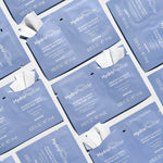 HydroPeptide Resurface and Repair peptide Peel pad sachets on a grey background