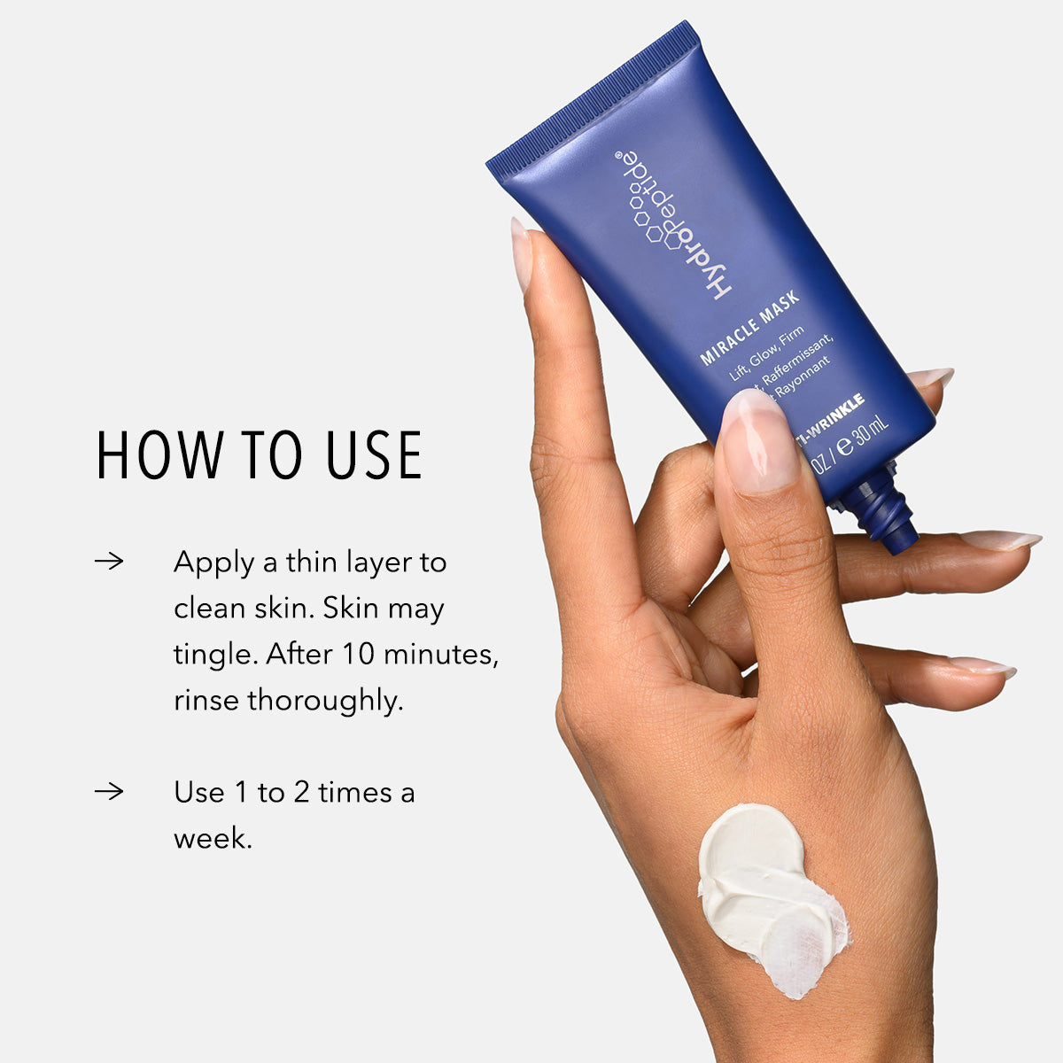 Hand holding HydroPeptide Miracle Mask with application instructions on a white background